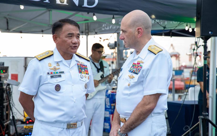 Philippine navy Vice Adm. Toribio Adaci speaks with Rear Adm. Joaquin J. Martinez de Pinillos, vice commander, U.S. 7th Fleet, during a reception aboard the USS Blue Ridge, June 20, 2024.