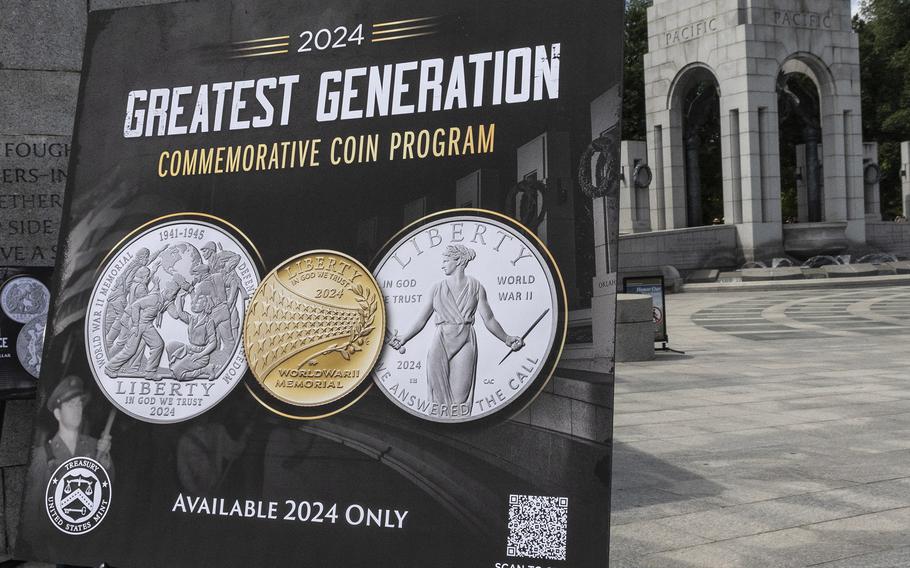 A poster promotes the new Greatest Generation coins during the 20th anniversary celebration of the National World War II Memorial in Washington, May 25, 2024.