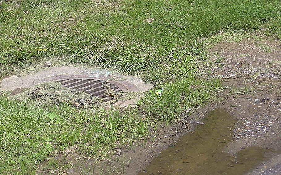 This open stormwater inlet was near where an estimated 2,000 to 3,000 gallons of unsterilized lab wastewater sprayed from an outdoor storage tank at Fort Detrick. The inlet sends water into Carroll Creek, a popular waterway that flows through downtown Frederick, Maryland. 