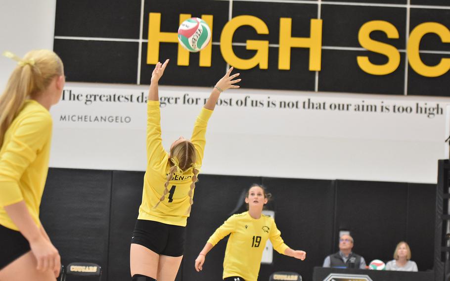 Vicenza senior setter Maya Fitch sets the ball behind her towards  Avonlea Sparling in the Cougars' three-set victory over Sigonella on Friday, Sept. 13, 2024 in Vicenza, Italy.