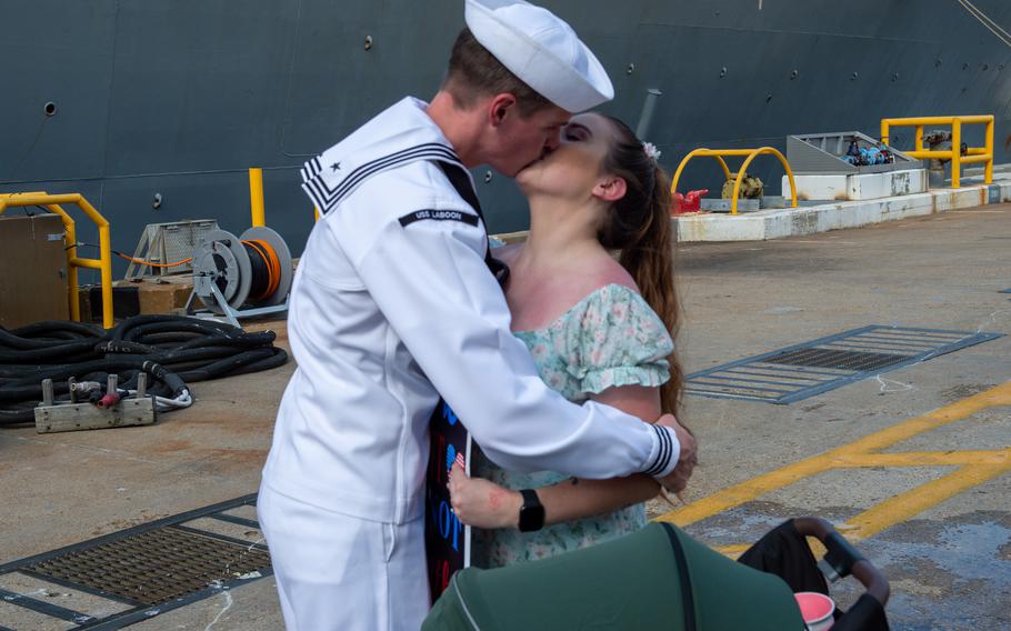 Fire Controlman (Aegis) 2nd Class Michael Pagan shares first kiss with his wife