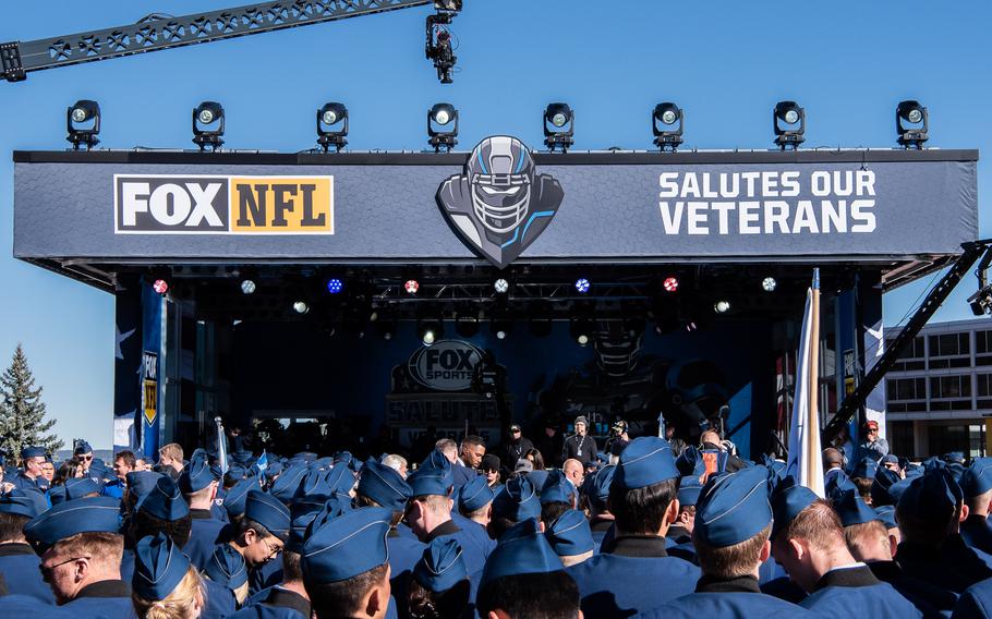 U.S. Air Force Academy students gather in front of a stage used for Fox’s NFL pregame show.