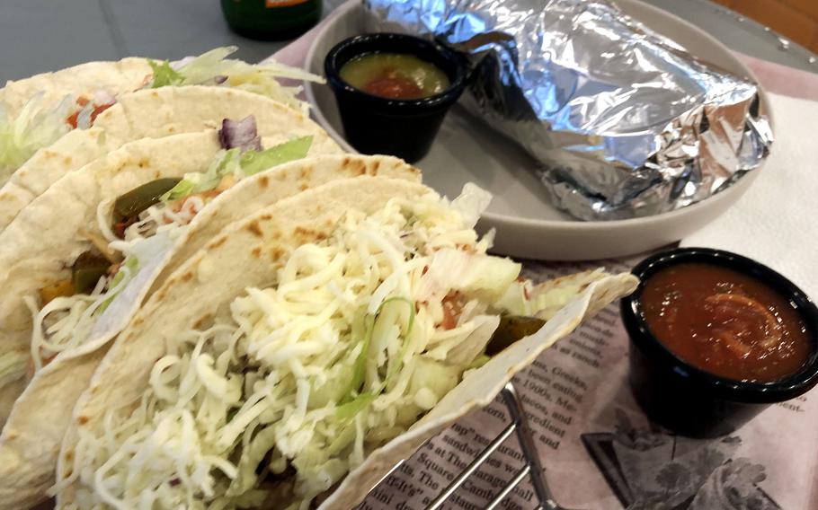 The veggie tacos, a burrito with salsa roja and the spicy salsa verde at Solecito Tex-Mex in Kaiserslautern.