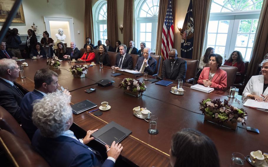 President Joe Biden, back row, center, speaks during a meeting with the members of his cabinet and first lady Jill Biden, in the Cabinet Room of the White House.