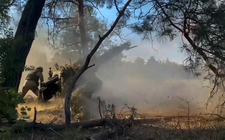 
Caption
In this photo taken from video released by the Russian Defense Ministry on July 12, 2024, Russian soldiers fire from their howitzer from their position at Ukrainian troops at an undisclosed location in Ukraine. 