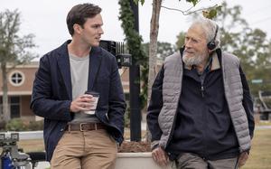 Nicholas Hoult, left, and director Clint Eastwood behind the scenes during production of their new film, “Juror #2,” a courtroom thriller about an impossible conundrum. It releases in theaters on Friday, Nov. 1. 