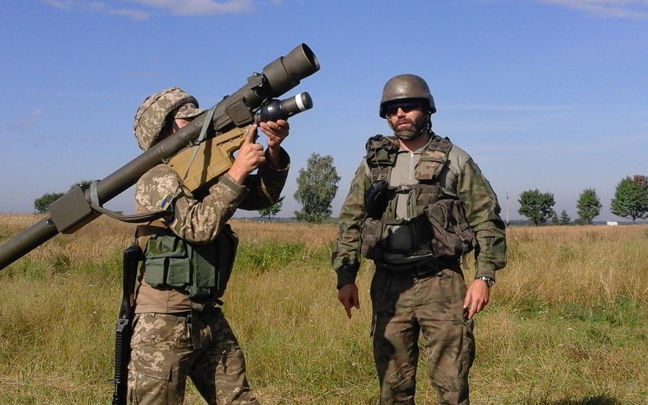 A Polish instructor assigned to the 21st Podhale Riflemen Brigade instructs a Ukrainian Soldier how to fire the 9K333 “Verba” portable air defense missile system, Aug. 9, 2023, at the International Peacekeeping and Security Center in Ukraine.
