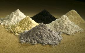 Six piles of powdery substances arranged in a rough triangle.