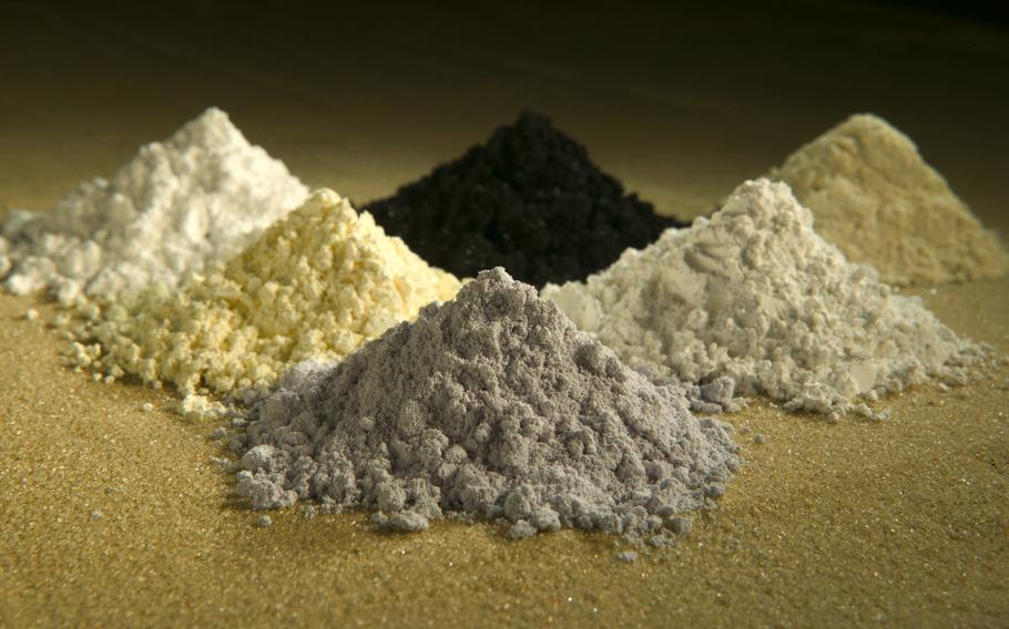 Six piles of powdery substances arranged in a rough triangle.