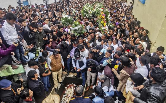 People attend the funeral of murdered Catholic priest Marcelo Perez at the San Andres Apostle church in San Andres Larrainzar, Chiapas State, Mexico, on Oct. 22, 2024. Priest Marcelo Perez, a well-known human rights defender who denounced violence linked to drug trafficking in Mexico, was shot dead on Oct. 20 in San Cristobal de las Casas. (Luis Enrique Aguilar/AFP via Getty Images/TNS)