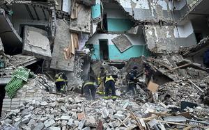 In this photo provided by the Ukrainian Emergency Services on Nov. 19, 2024, rescue workers clear the rubble of a residential building destroyed by a Russian strike in Hlukhiv, Ukraine. (Ukrainian Emergency Service via AP)