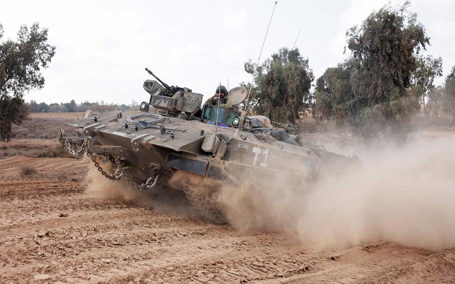 Israeli troops advance near the border with the Gaza Strip on Nov. 14, 2023, amid ongoing battles between Israel and the Palestinian group Hamas.