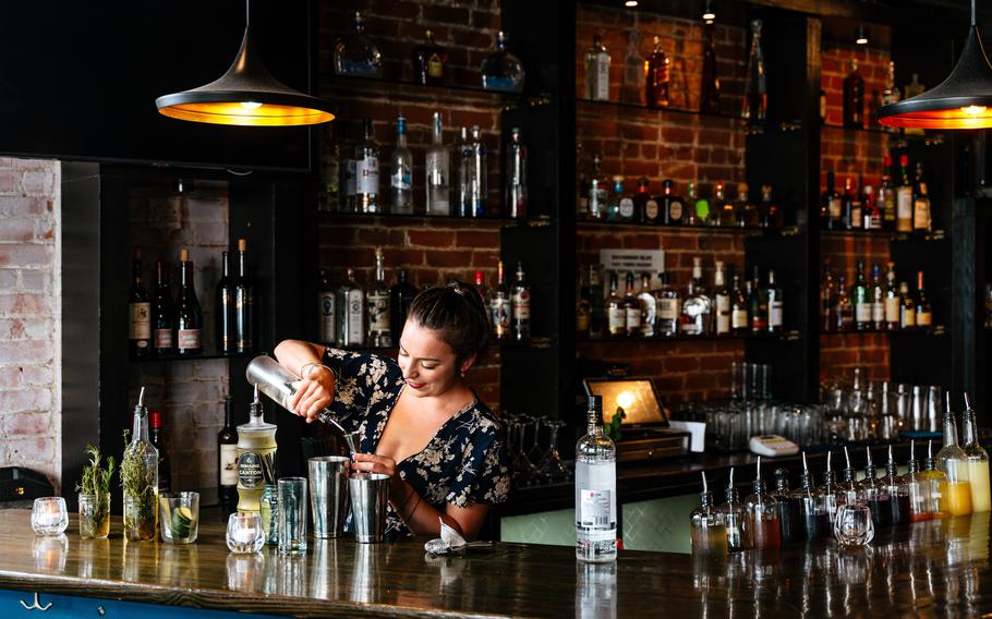 The front-of-house manager, Shannon Casey, makes an original “Thyme’s Up” cocktail at Savannahblue.  Co-owner J.D. Simpson said the lack of diversity in Detroit’s city center inspired them to open a venue that not only addressed African American legacy in hospitality but also celebrated Black culture in Detroit.