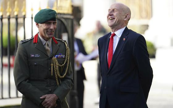 U.K. Defence Secretary John Healey speaks to Brigadier Jonathan Sear at Trinity House in London, Oct. 23, 2024.