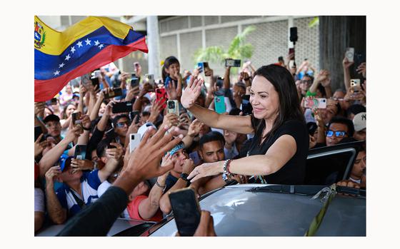 Opposition Leader Maria Corina Machado, waves to the crowd, during a rally at Universidad Central de Venezuela on July 14, 2024, in Caracas, Venezuela. (Jesus Vargas/Getty Images/TNS)