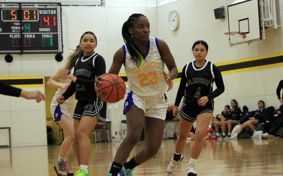 Beverly Gardner dribbles up the court.