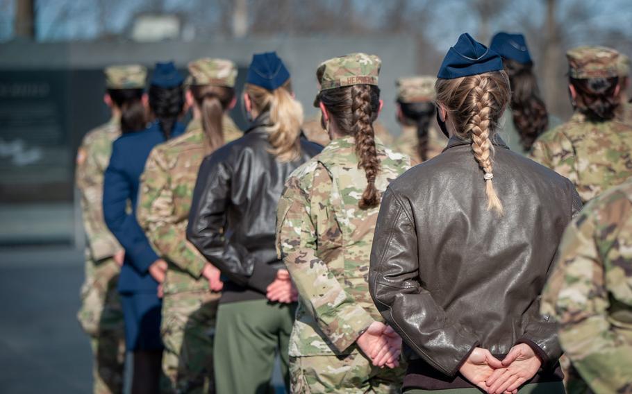 Female service members standing in formation.