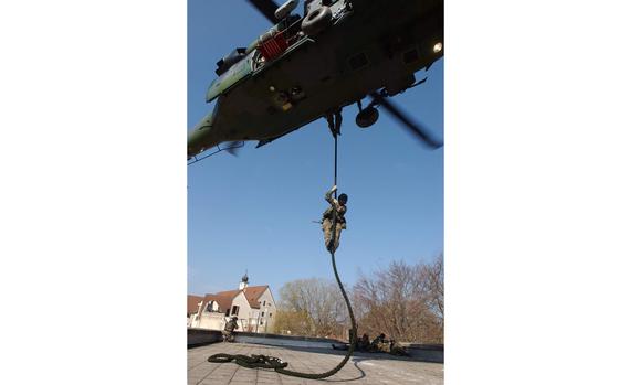 HED: Coming for you, 2004

Hohenfels, Germany, Mar. 31, 2004: Staff Sgt. Ron Ellis fast-ropes in from an MH-60 helicopter during a Combat Search and Rescue exercise. Members from the 56th Rescue Squadron out of Keflavik Naval Air Station, Iceland, trained together with those from 81st Fighter Squadron at Spangdahlem Air Base, the 786th Security Forces Squadron, and the 236th Medical Company. If the aircraft is downed anywhere within the U.S. Air Forces in Europe’s area of responsibility, which extends from Iceland to the southern tip of Africa, it’s likely going to be the 56th, the command’s only combat search and rescue unit. With two active combat zones in Iraq and Afghanistan, the units were glad to get some hands-on experience. 

META TAGS: Combat Search and Rescue; CSAR; U.S. Air Force; U.S. Army; Survival, Evasion, Resistance and Escape; SERE;