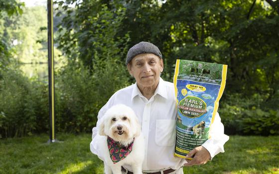 Jackson Madnick with his dog, Zoe, who is the “spokesdog” for Pearl’s Premium, the grass mix that he developed. His grass seed mix can thrive without chemicals and with minimal watering.