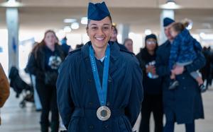 Airman Anita Alvarez poses for a photo with her 2024 Paris Olympics silver medal after Basic Military Training graduation at Joint Base San Antonio-Lackland, Texas, on January 9, 2025. Alvarez is a three-time olympian who will be joining the Department of the Air Force World Class Athlete Program as the first recruited Olympic medalist in the programs history. (U.S. Air Force photo by Kate Anderson)