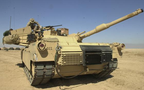 Somewhere in the desert, Kuwait, Feb 1, 2003: A crew from the 1st Tank Battalion, 1st Marine Division readies their M1-A1 Abrams tank at a camp in the Kuwaiti desert, near the so-called Highway of Death. The road where American airpower destroyed a long column of retreating Iraqi armor in the first Gulf War, is back in business. But this time, thousands of U.S. troops, tanks and artillery pieces are heading north on the barren road from Kuwait City to Baghdad, with a different purpose.

Read more at: https://www.stripes.com/living/u-s-troops-revisit-scene-of-deadly-gulf-war-barrage-1.5305

META TAGS: Gulf War; Operation Iraqi Freedom; logistics; military supplies; equipment; U.S. Marine Corps; USMC; Marine logisitics; 