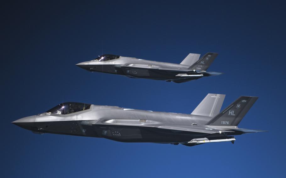 Two F-35A Lightning IIs fly in formation after receiving fuel from a KC-135R Stratotanker from the 28th Expeditionary Air Refueling Squadron, May 15, 2019 at an undisclosed location.