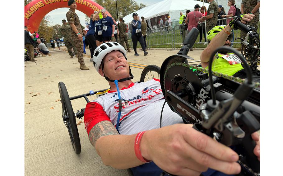 Navy veteran Jay McManus leaves as the winner of the Marine Corps Marathon push-rim race Sunday, Oct. 29, 2023, in Arlington, Va. 