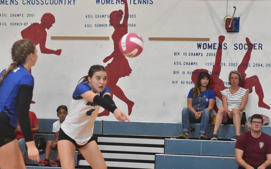 Rota’s Kate Warkentien bumps the ball - and avoids getting swiped by red shadows on the wall - in the Admirals’ five-set victory over Aviano on Saturday, Oct. 14, 2023.