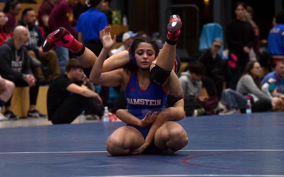 Uno Tate flips over Genesis Esparza.