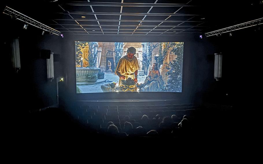 People watch a movie in one of the theaters at a movie theater complex in Nuremberg,