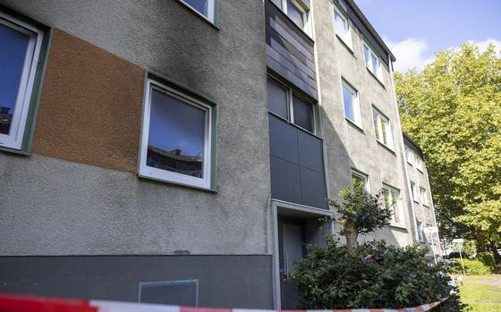 This photo shows an apartment building after a fire in Essen, Germany Sunday, Sept. 29, 2024. (Thomas Banneyer/dpa via AP)