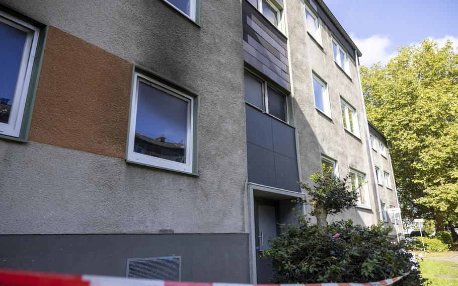 Police tape surrounds a building after a fire in Essen, Germany.