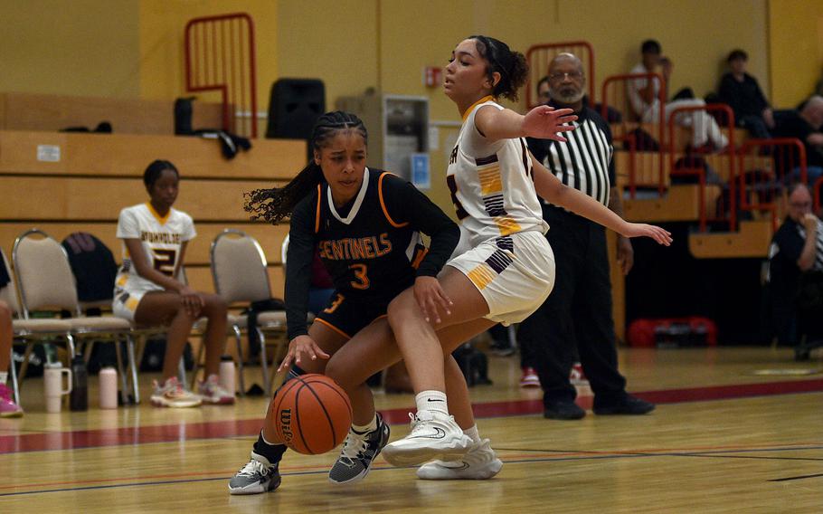 Aniya Robinson drives past Marley Wilson.