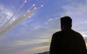 North Korean leader Kim Jong Un watches a multiple rocket launch from Pyongyang, May 30, 2024, in this image from the Korean Central News Agency.