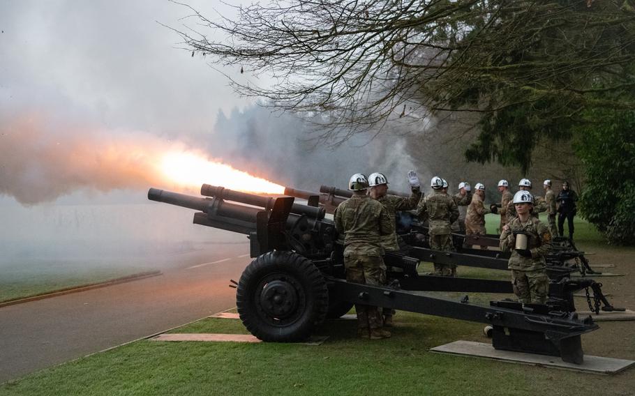 Cannons operated by U.S. soldiers fire.