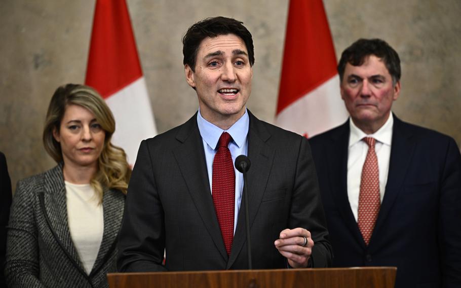 Justin Trudeau makes a point during a news conference.