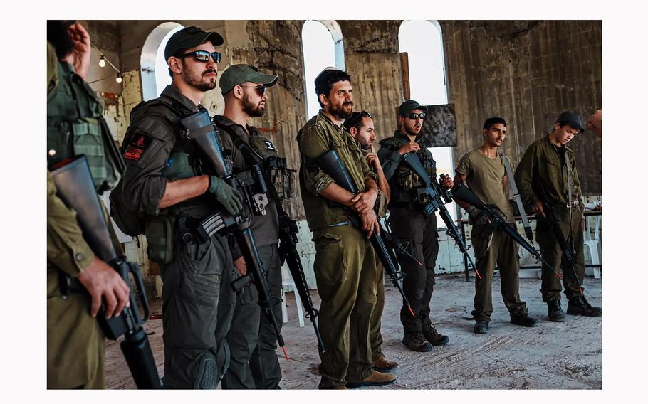 Reservists, residents and volunteers from Israel and the United States line up for combat training in Mitzpe Yair, an Israeli settlement near the West Bank town of Susya. 