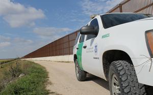 A U.S. Customs and Border Protection vehicle stands watch by one of the many walls constructed near the border, along the Rio Grande River, to disrupt the flow of illegal contraband and aliens across our border. The Georgia National Guard volunteered to deploy to the Rio Grande Valley in Texas for all of 2014 to support the Border Patrol with aerial detection and monitoring as part of Operation River Watch II on the U.S. border with Mexico in Texas. (Georgia Army National Guard photo by Maj. Will Cox/Released)