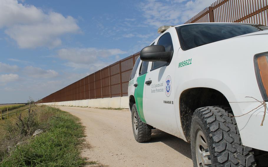 A U.S. Customs and Border Protection vehicle stands watch by one of the many walls constructed near the border, along the Rio Grande River, to disrupt the flow of illegal contraband and aliens across our border. The Georgia National Guard volunteered to deploy to the Rio Grande Valley in Texas for all of 2014 to support the Border Patrol with aerial detection and monitoring as part of Operation River Watch II on the U.S. border with Mexico in Texas. 