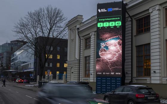 A screen near the Energy Museum and Mindaugas Bridge indicates that on February 8 the Baltic States will disconnect from the Russian electricity grid to synchronise with Continental Europe, in Vilnius, Lithuania, Tuesday, Feb. 4, 2025. (AP Photo/Mindaugas Kulbis)