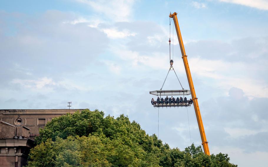 Dinner in the Sky is a touring event that dangles brave diners willing to shell out for a unique experience from a crane.