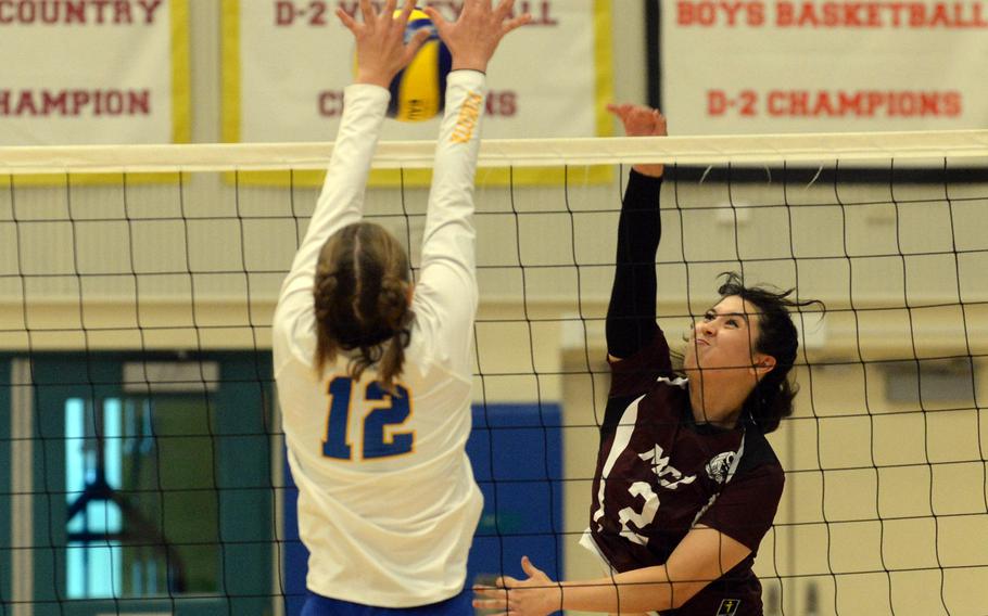 Matthew C. Perry's Jessica Griffin has her shot blocked by Yokota's Kayla Bogdan during Friday's DODEA-Japan girls volleyball match. The Samurai rallied from two sets down to win in five sets.