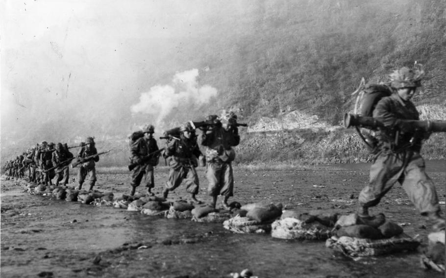 ROK troops cross a river during Operation Killing Zone.  