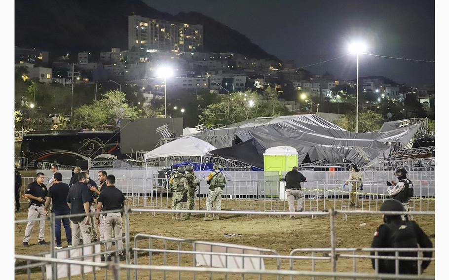 Security forces stand around a stage that collapsed due to a gust of wind during an event attended by presidential candidate Jorge Álvarez Máynez in San Pedro Garza García, on the outskirts of Monterrey, Mexico, Wednesday, May 22, 2024.