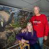 Avid puzzler and puzzle collector Linda Groskreutz, 67, poses for a portrait with her husband Jeff, 69, in front of two giant puzzles on display in their home in Madison Lake, Minn. 