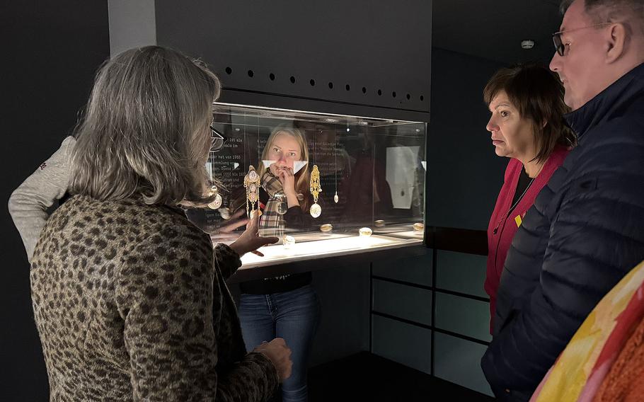 Visitors listen to a tour guide during a mid-December 2024 visit to the Pforzheim Jewelry Museum in Pforzheim, Germany. The tour in German is offered to guests at 3 p.m. Sundays.