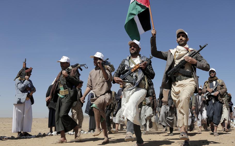 Houthi rebel fighters march during a rally of support for the Palestinians in the Gaza Strip and against the U.S. strikes on Yemen outside Sanaa on Jan. 22, 2024.