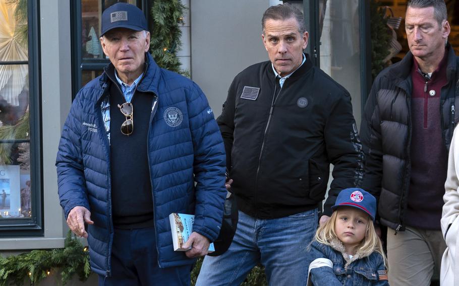 President Joe Biden accompanied by his son Hunter Biden and his grandson Beau 