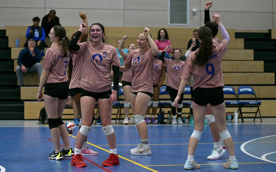 The Pink team, including, from left, Brussels Lucia Martinez, Vilseck’s Sophie Fedorisin, Black Forest Academy’s Priscilla Sivonen and Wiesbaden’s Bridget Pidgeon, celebrate an ace during the 2024 DODEA-Europe All-Star volleyball matches on Nov. 9, 2024, at Ramstein High School on Ramstein Air Base, Germany.