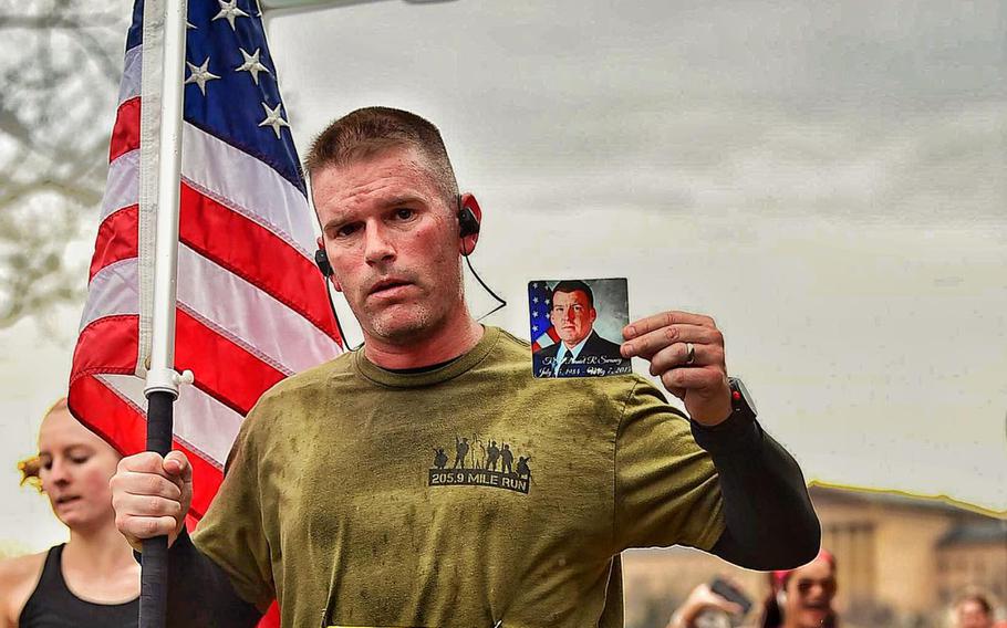 Master Sgt. Trevor Derr carries a photo of his friend, Tech. Sgt. Daniel Swaney, while running the Philadelphia LOVE Half Marathon in April 2019. Derr, the flight chief of the 721st Aircraft Maintenance Squadron at Ramstein Air Base, has been running since 2018 to honor his friend, Tech. Sgt. Daniel Swaney, who died by suicide in 2015 while suffering from post-traumatic stress disorder. He also runs to raise awareness of PTSD.